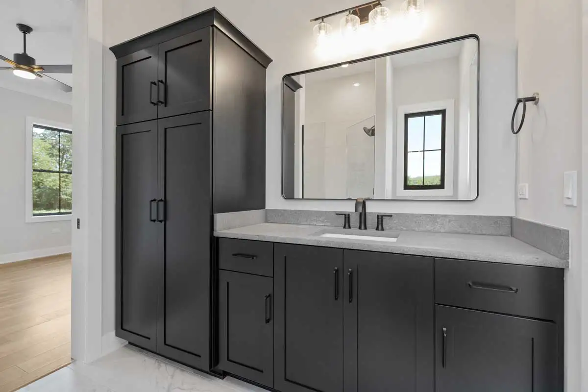 Custom-bathroom-design-featuring-neutral-tile-and-black-fixtures.Hampshire_IL.webp